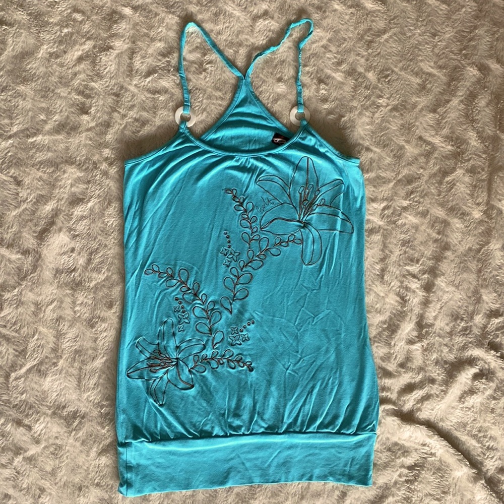 Racerback tank with shell strap embellishments and embroidery flowers